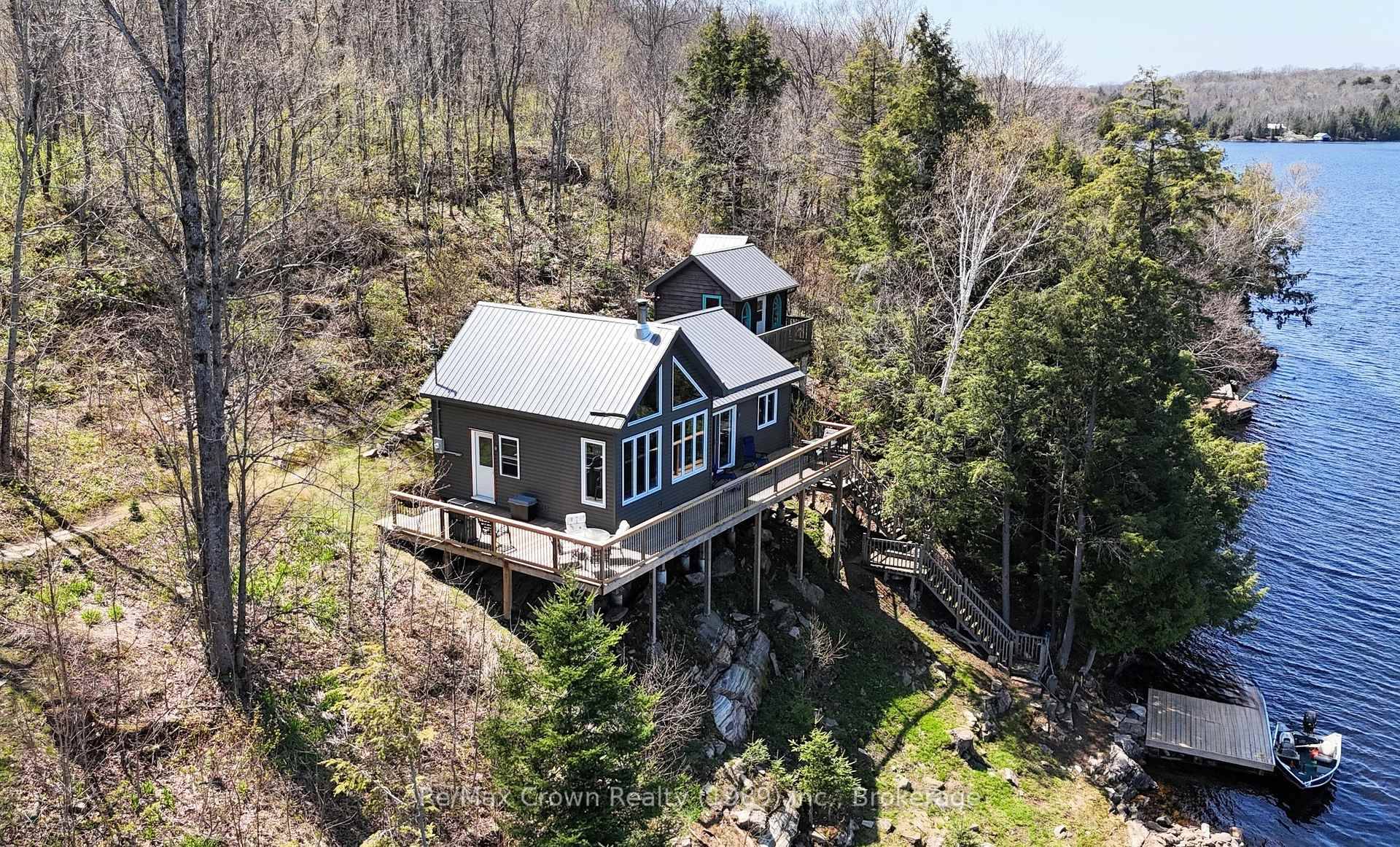 Your Lakeside Retreat Awaits in this Newly built Chalet Style Cottage on Beautiful Wilson Lake part of the sought after Pickerel River system offering over 40 miles of navigable waterways.