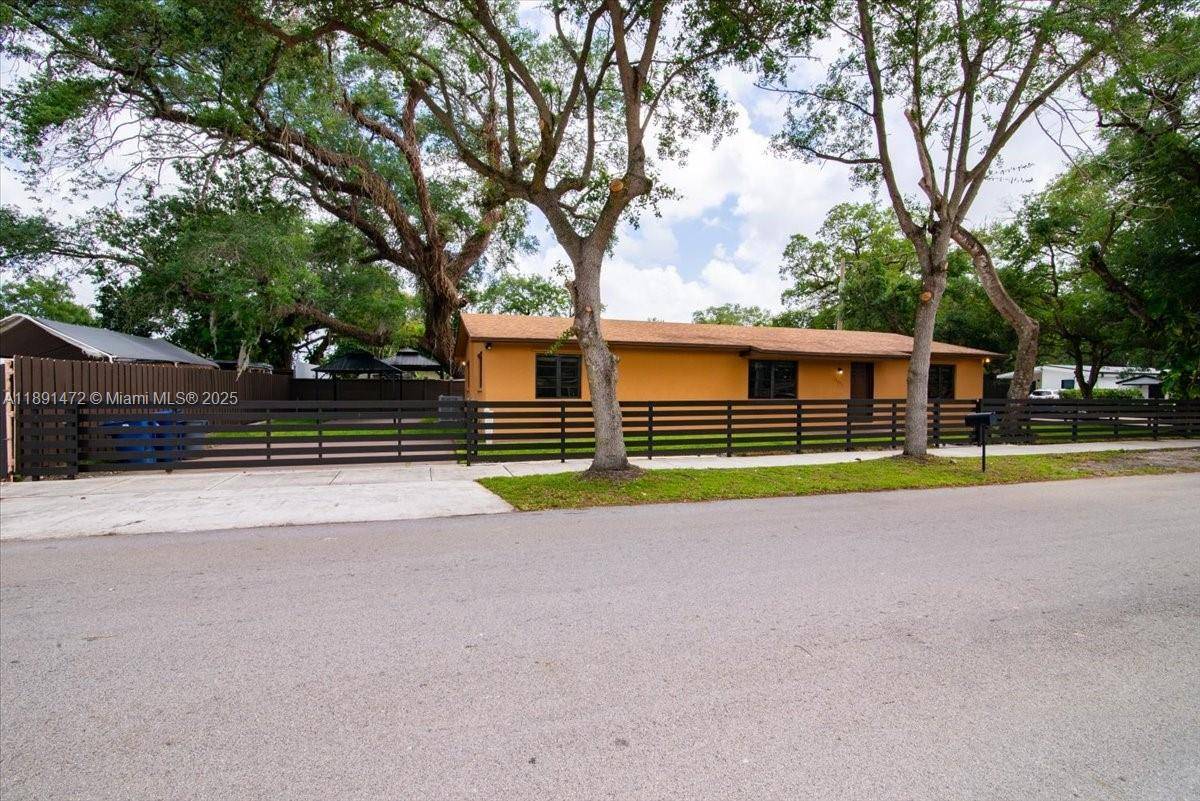 Spacious 4 bedroom 2 bath home with a newer roof on corner lot in Miami Gardens.