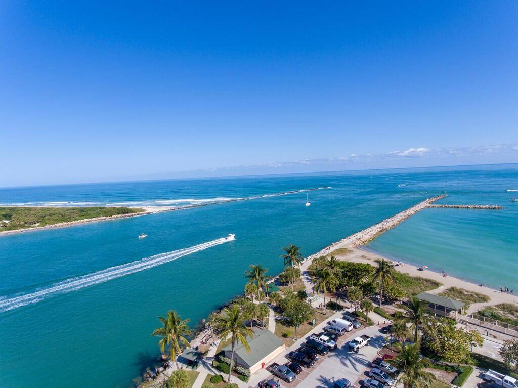 Enjoy true island living in this highly desired 1st floor corner unit at La Entrada Del Mar on South Hutchinson Island !