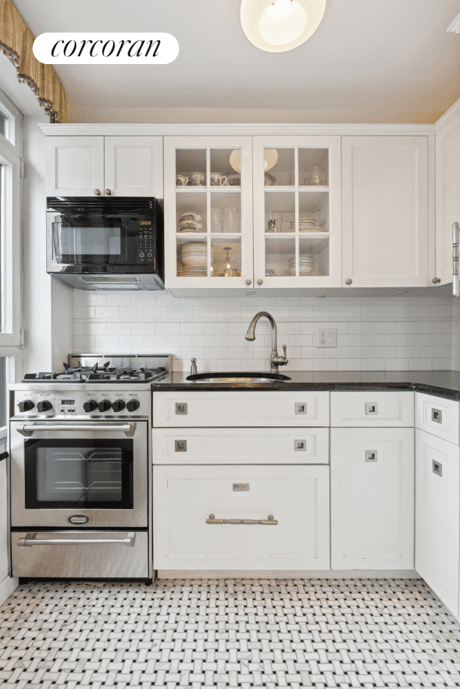 Enter this sun flooded, south facing home into the gracious entry foyer, which leads to a charming, oversized living dining room featuring beautiful custom built in bookshelves, beamed ceilings, and ...