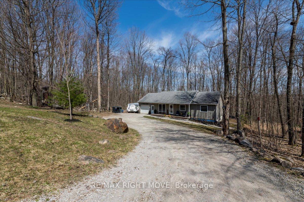 Welcome to 5 Snowshoe Trail, a beautifully maintained bungalow nestled on a scenic half acre lot in the heart of Moonstone.