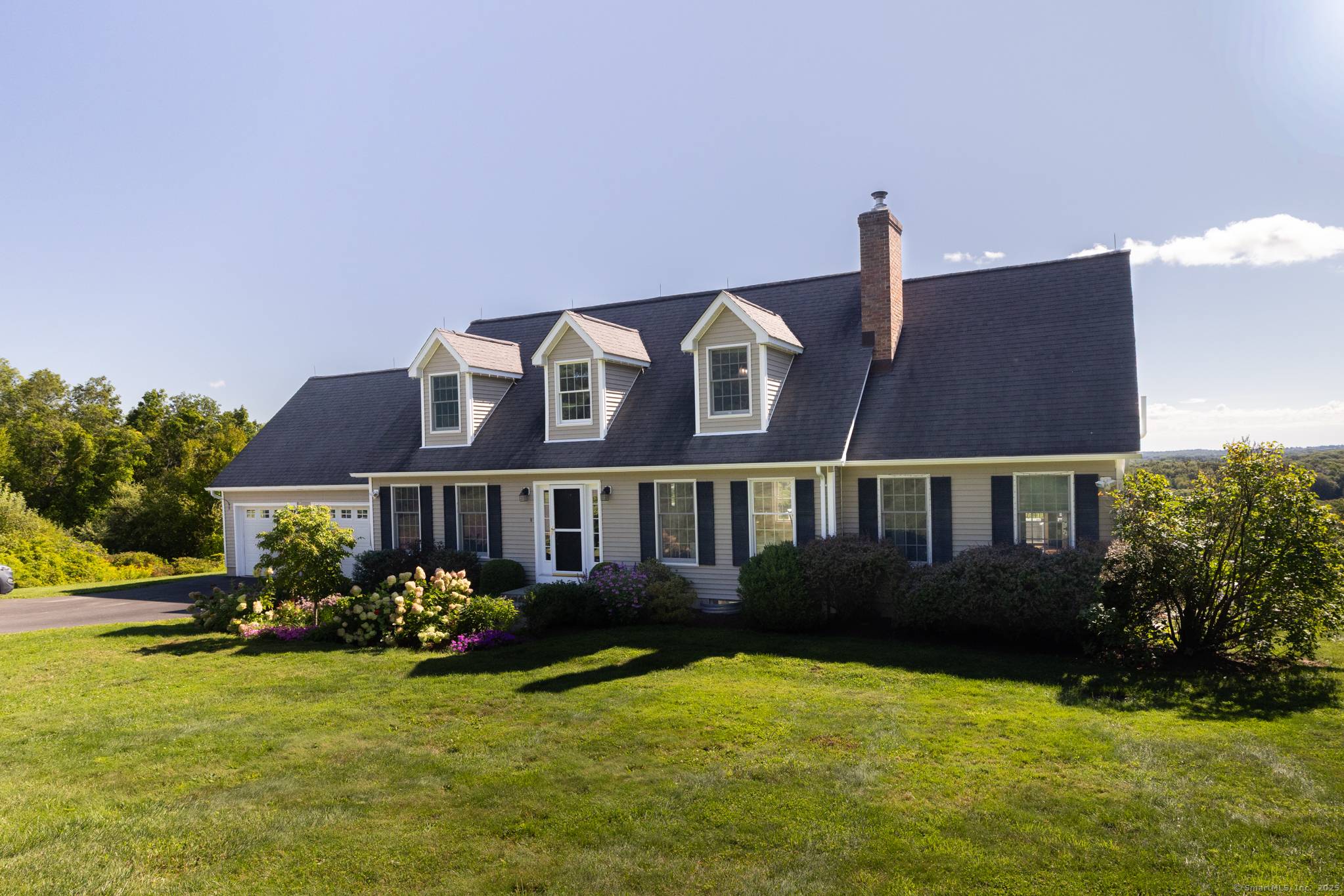 Tucked away on 8 private acres at the end of a cul de sac, this Bantam Cape Cod offers some of the best views in Litchfield County !