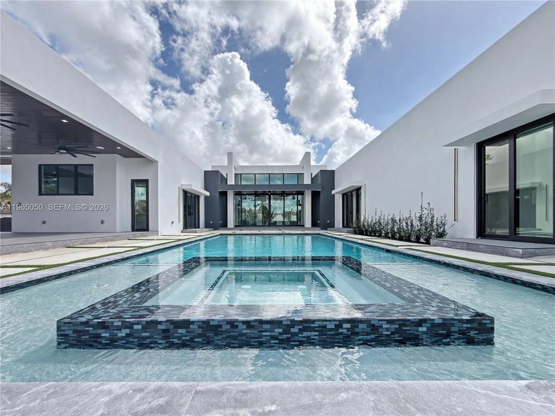 Experience elevated living in this breathtaking modern luxury estate situated on 1.