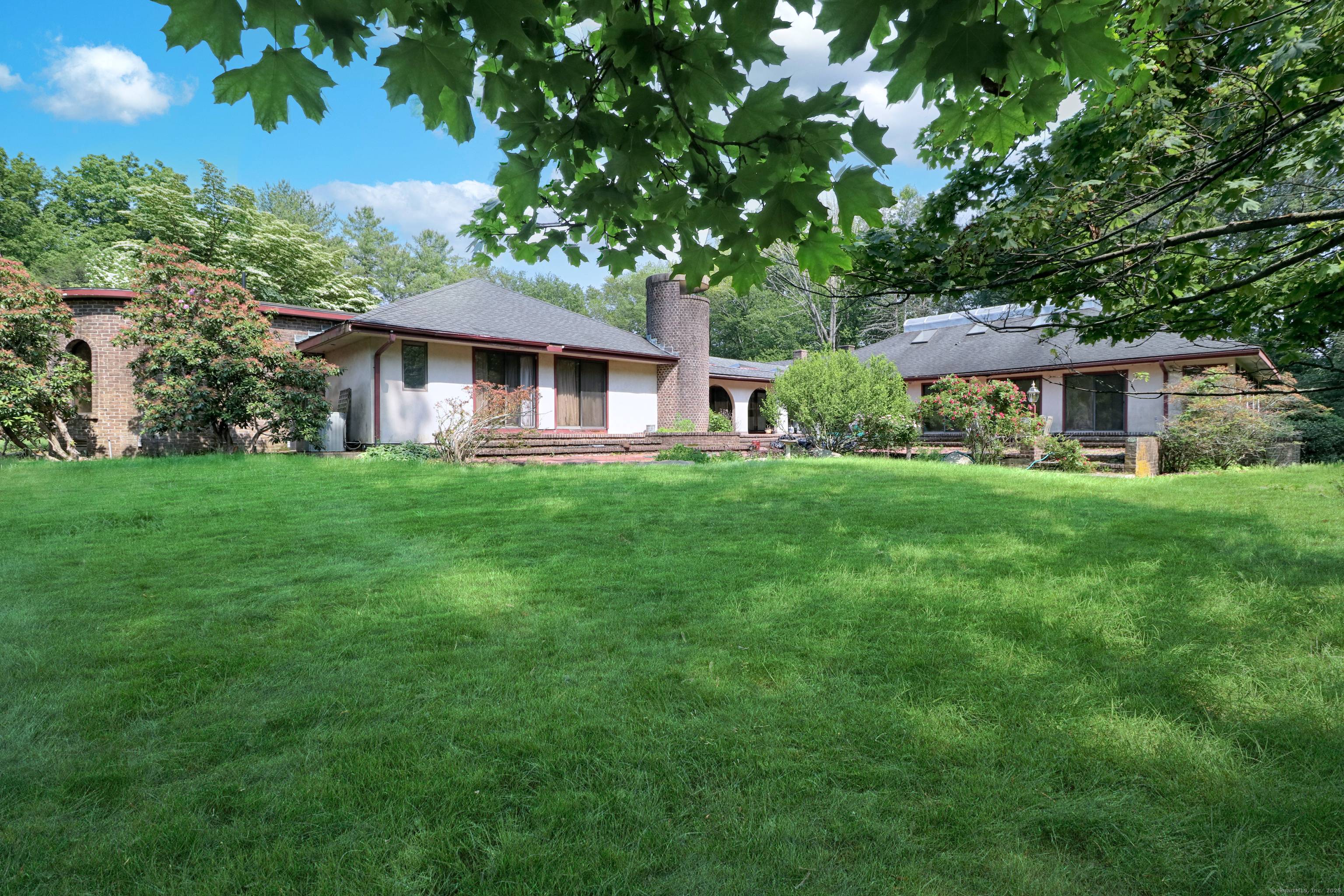 Sprawling ten room ranch style residence offering three acres on a prime estate street in Greenfield Hill.