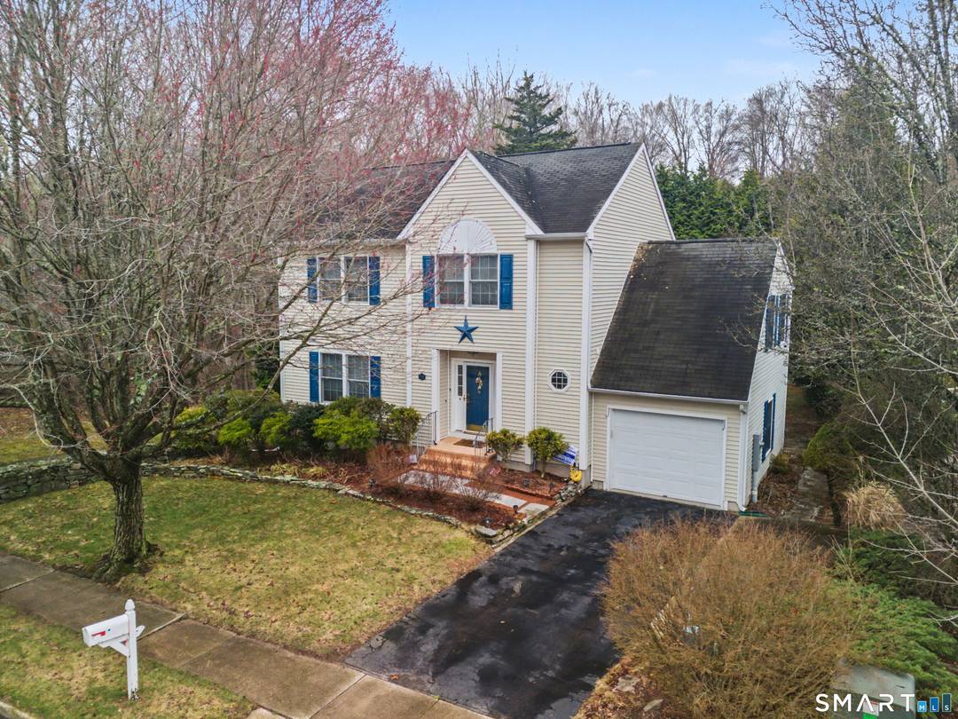 Welcome to this beautifully maintained Colonial nestled in a desirable and established neighborhood in Mystic Groton.