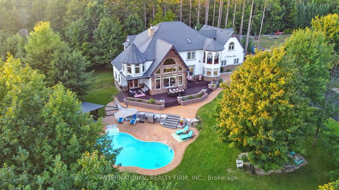 Experience the ultimate retreat in this stunning custom built estate, perfectly positioned on a private 1.
