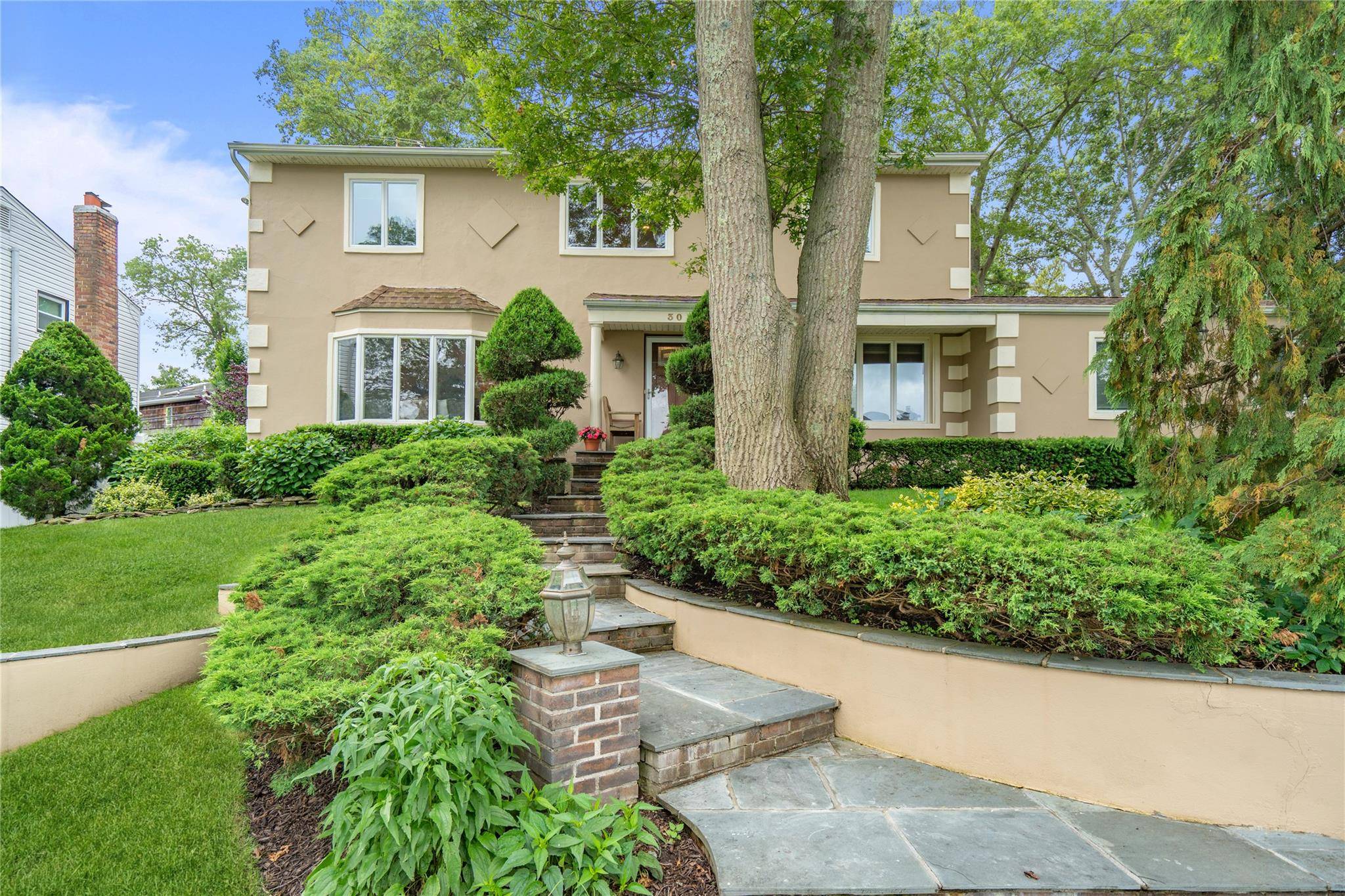 Welcome to this stunning, extended and beautifully updated Center Hall Colonial with 4 bedrooms on one level ; ideally and majestically located mid block, elevated and set back from the ...