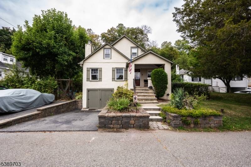 Charming lake style home with tons of character and incredible lake views from the covered front porch !