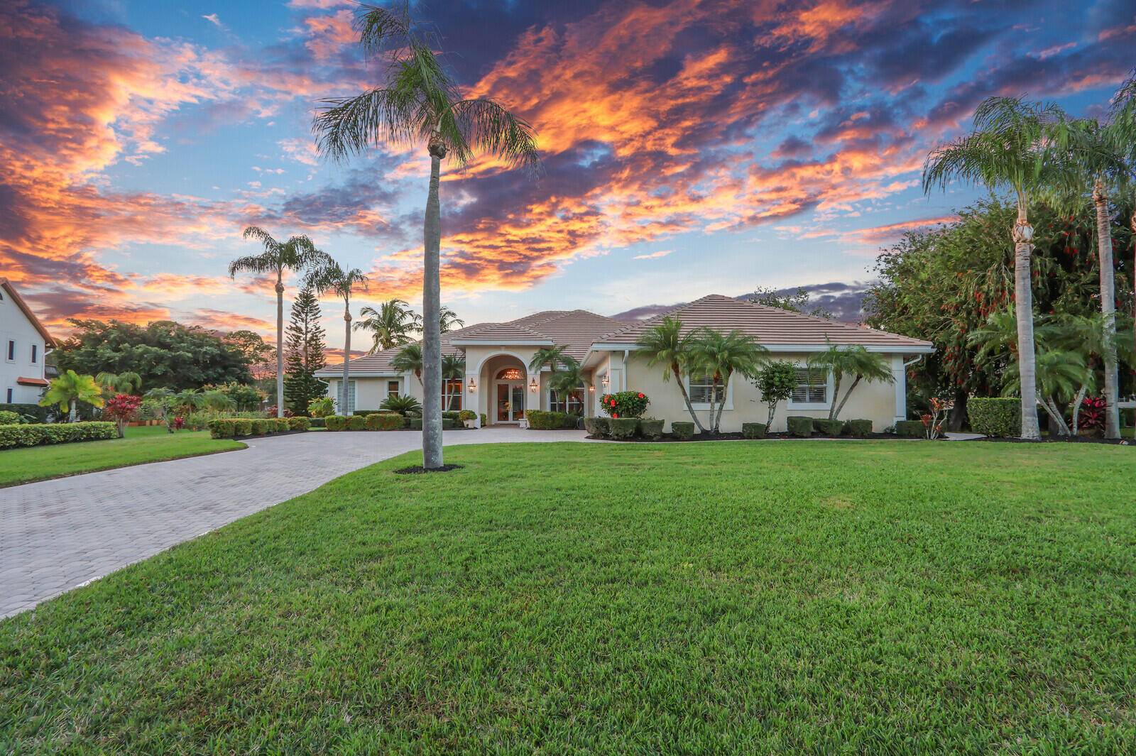 STUNNING 1. 49 ACRE LAKEFRONT PROPERTY offers breathtaking water views a tranquil, private setting.