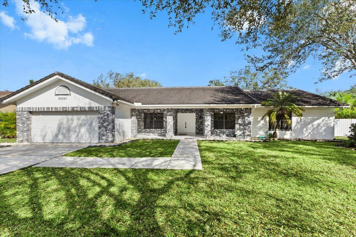 Now available for rent ! The kitchen has been updated with a sleek, modern design and features an island with bar stool seating, perfect for enjoying breakfast or casual snacks.