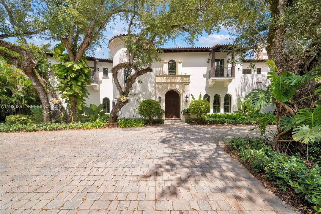 This stunning two story Italian villa, thoughtfully designed by Giorgio Balli, is situated in the exclusive Ponce Davis neighborhood.