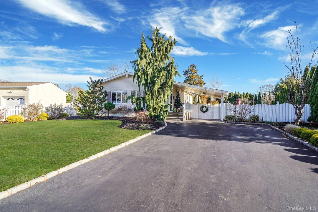 Welcome to this beautifully maintained mid century modern 3 bedroom 2 bath ranch in the heart of all that Smithtown Saint James has to offer !