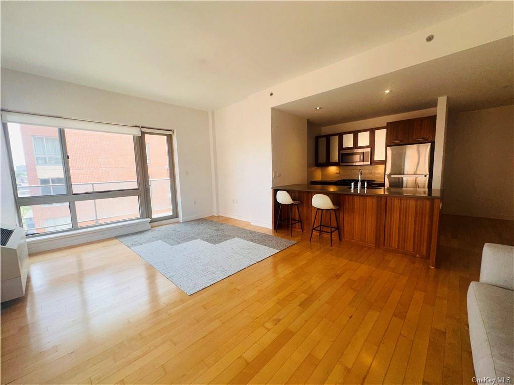 Welcome to Apartment 4A at The Latitude in Riverdale, a luxurious two bedroom, two bath oasis with direct eastern exposure.