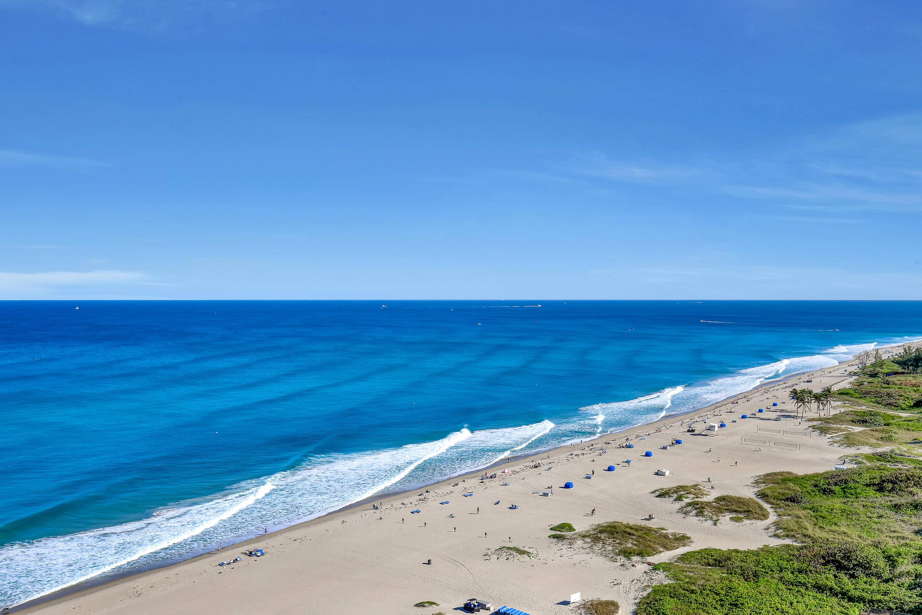 Southeast exposure with stunning ocean to intracoastal views, wide sandy beach.