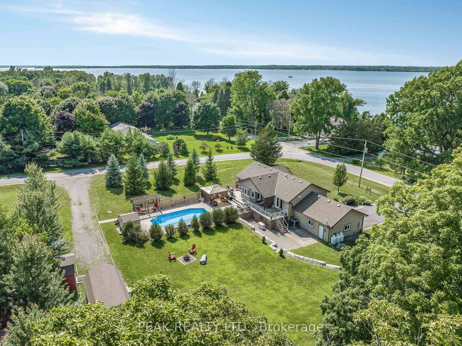 Wake up to sweeping views of Lake Ontario in this custom built bungalow that blends everyday comfort with true luxury.