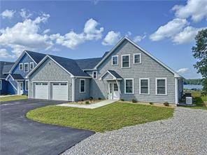 This breathtaking luxury townhouse overlooking Gardner Lake is ready for you to call it home !