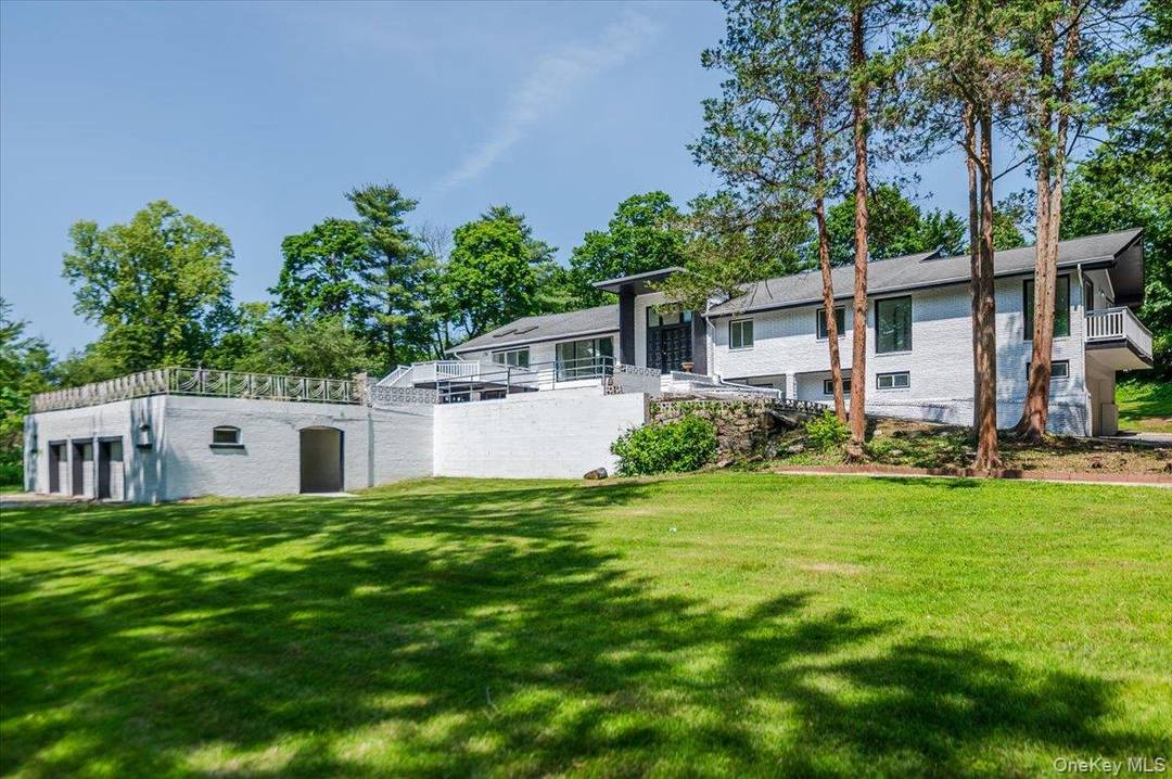 Welcome to this sprawling sunlit ranch with vaulted ceilings and large open floor plan.