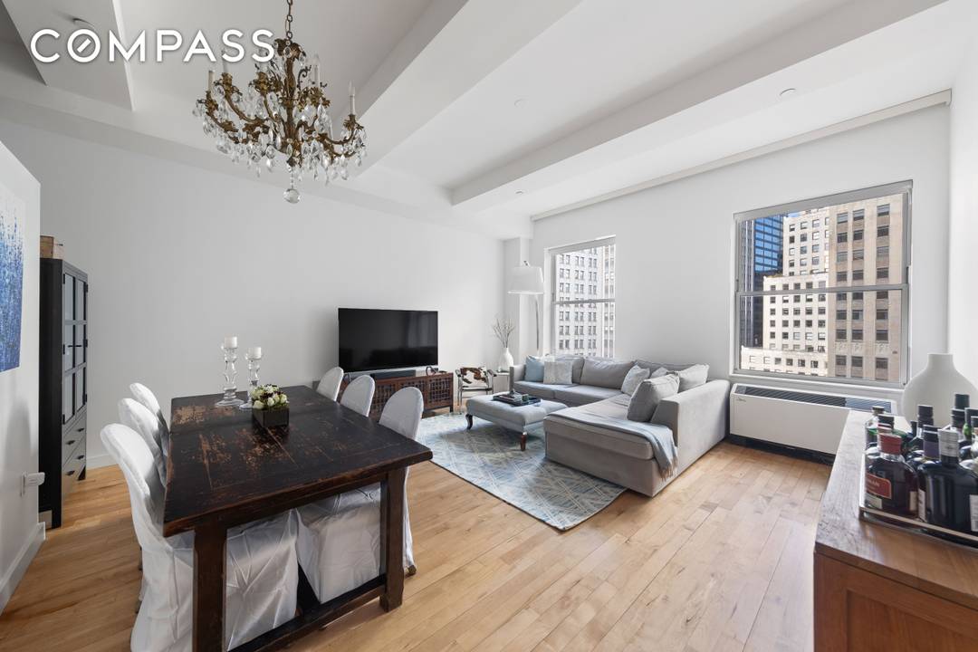 THE LOFT Welcome to Loft 2104, an open plan home that functions effortlessly as a two bedroom apartment, perched high above Wall Street with light, scale, and plenty of cool ...