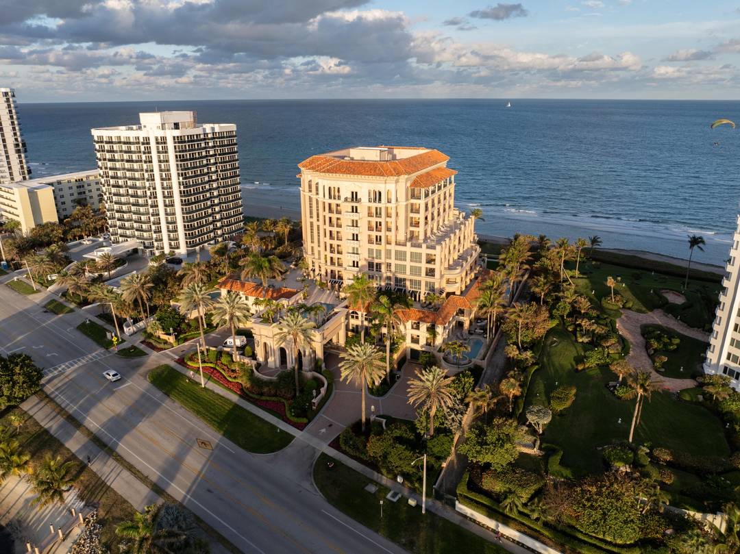 SPECTACULARLY REMODELED CORNER RESIDENCE AT EXCELSIOR WITH MESMERIZING SUNSET VIEWS TO LAKE BOCA RATON.