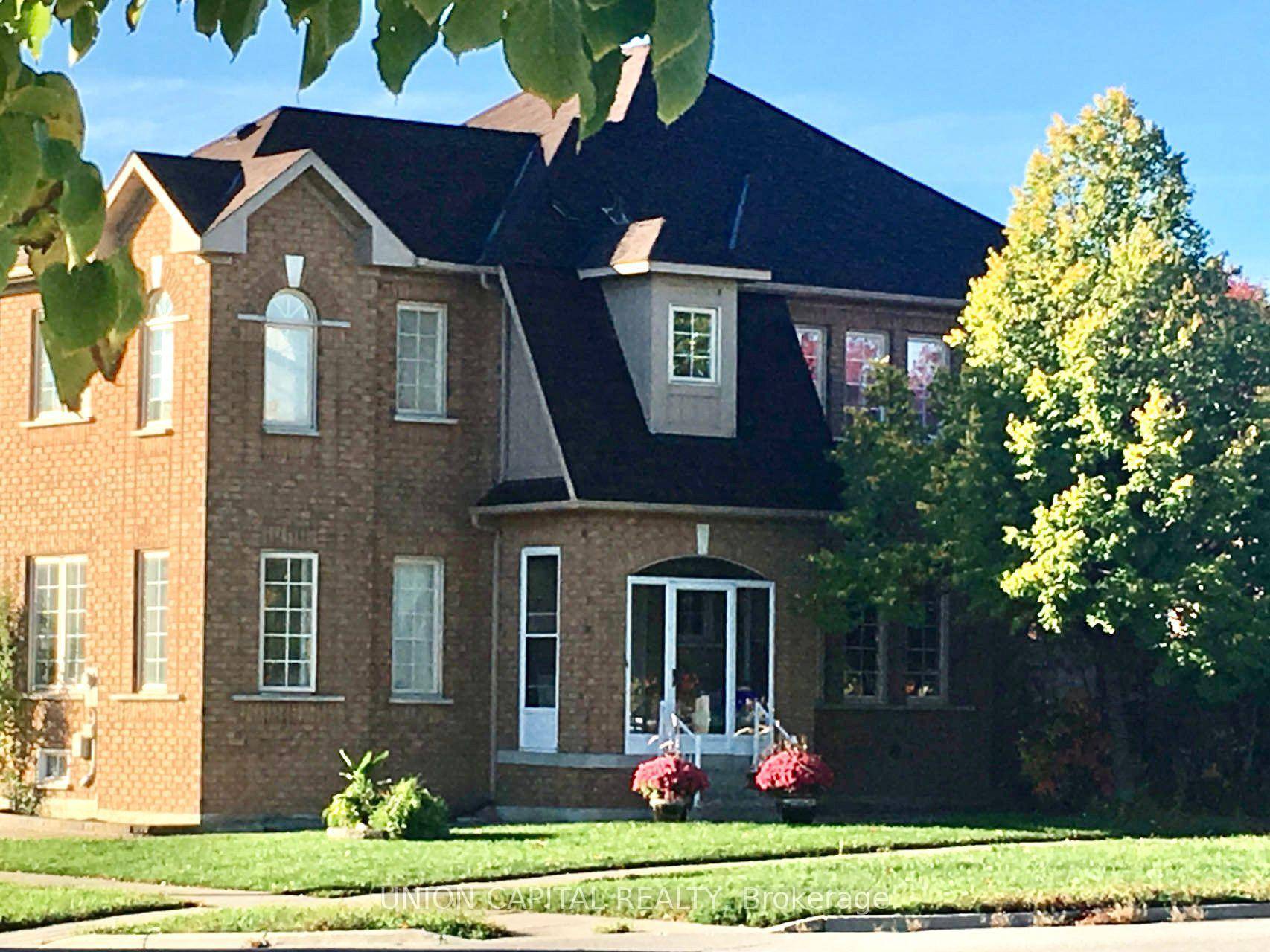Exceptionally bright corner detached home with double garages in the heart of Richmond Hill, featuring extra large windows with beautiful park views.