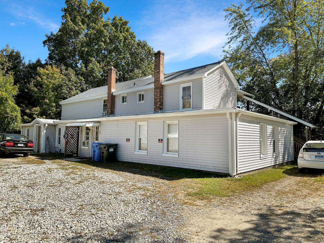 Opportunity knocks ! This fully occupied 3 family home on 1.