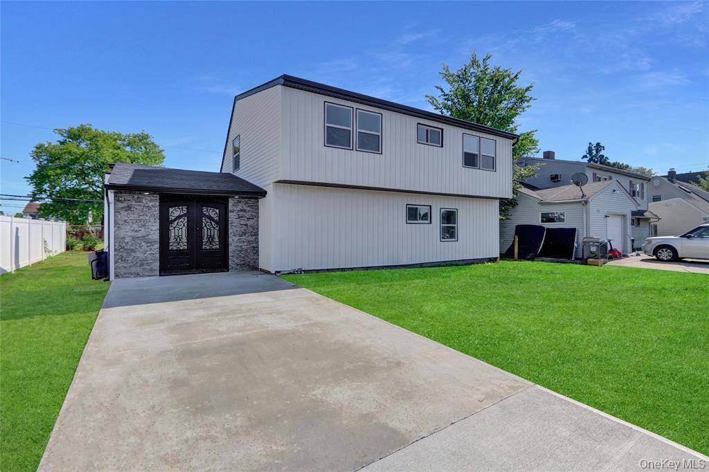 Welcome to this exquisite colonial nestled in the quiet Levittown neighborhood.