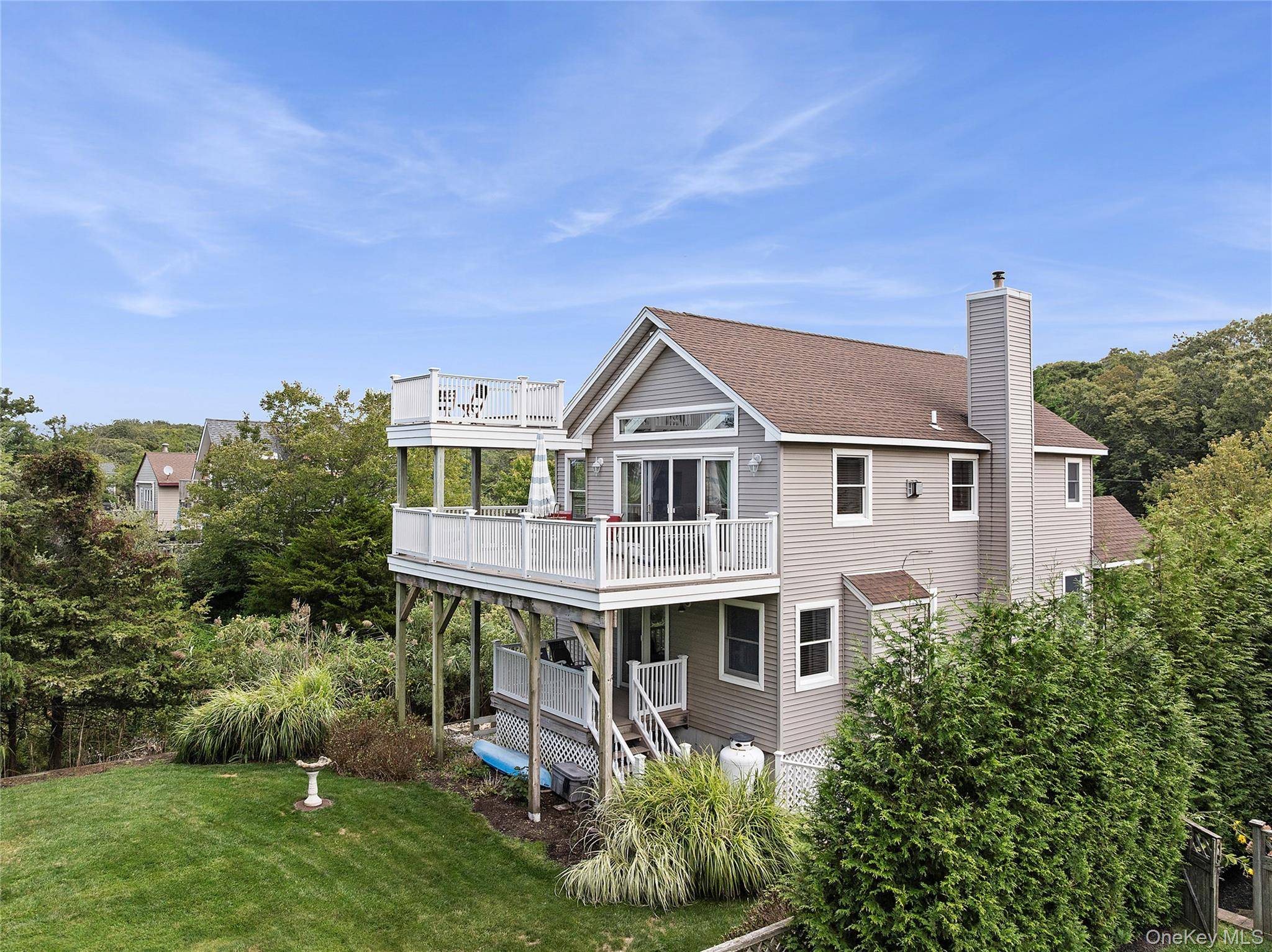 North Fork Coastal Living by the Sound Located in Peconic near Goldsmith Inlet and the Long Island Sound, this post modern 4 bedroom home blends modern comfort with the essence ...