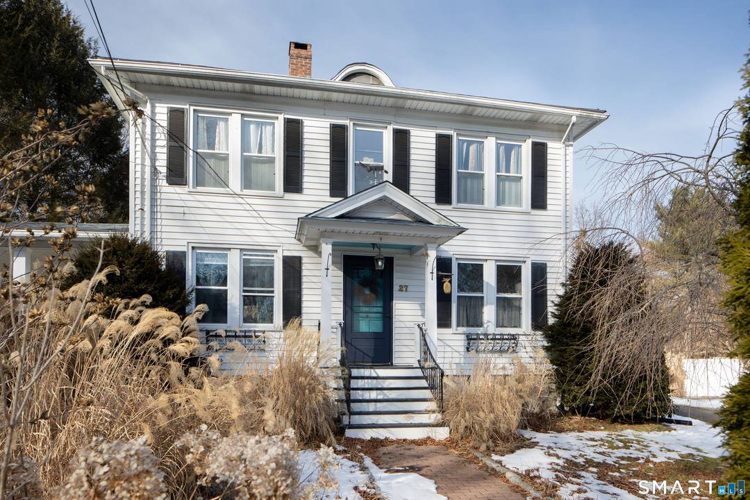This early 1900's Colonial is filled with warmth, character, and outdoor charm.