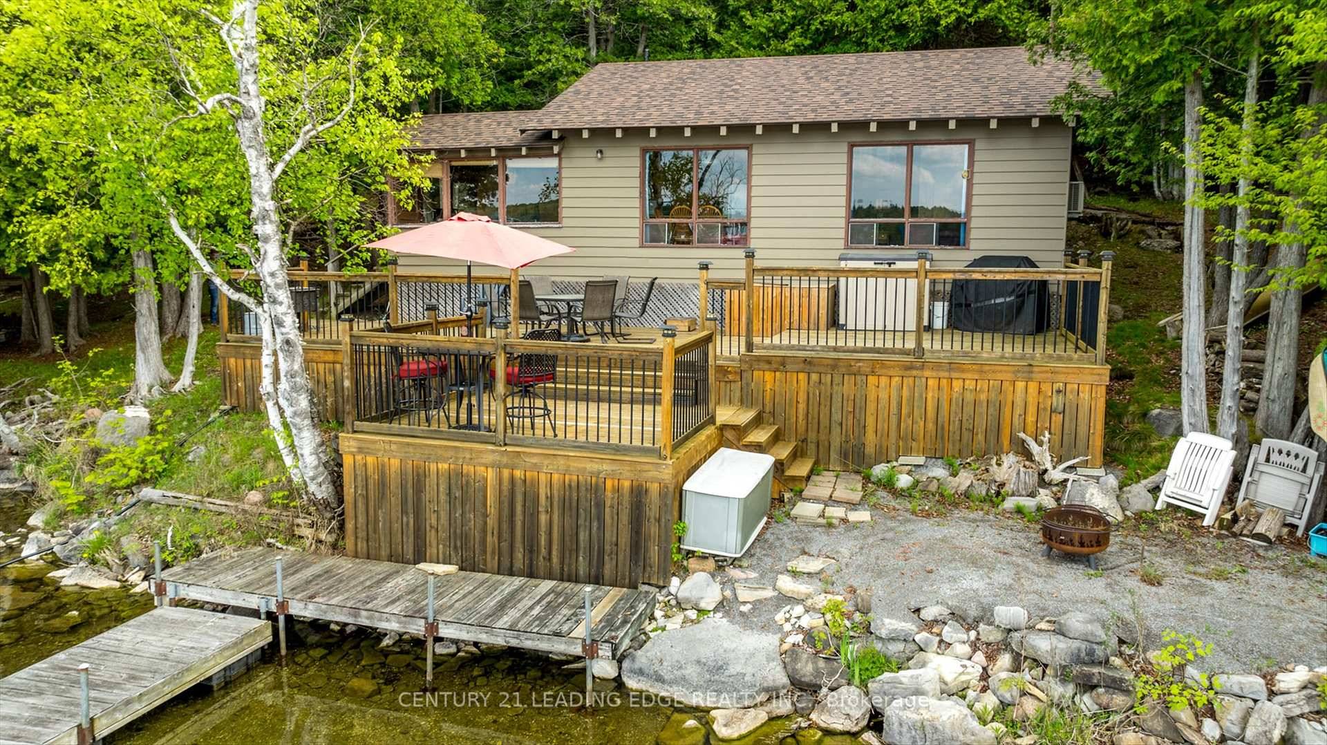 Retreat to this enchanting 3 season waterfront cottage, offering year round access to the tranquility of lakeside living.