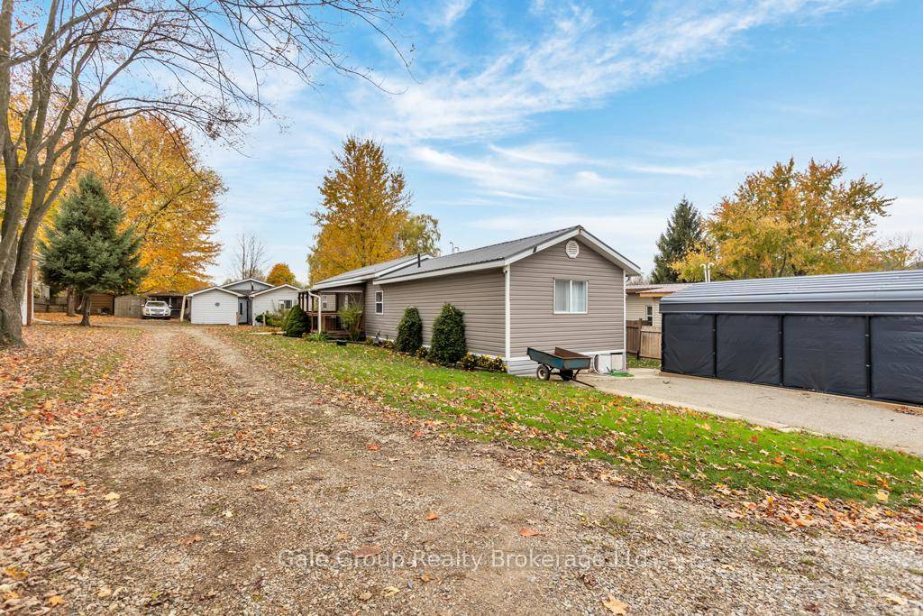 Year Round Park Very well maintained Two bedroom, one bath, 830 sqft Mobile home 1984 with back deck built in 2021, Large shed and Coverall for your vehicle.