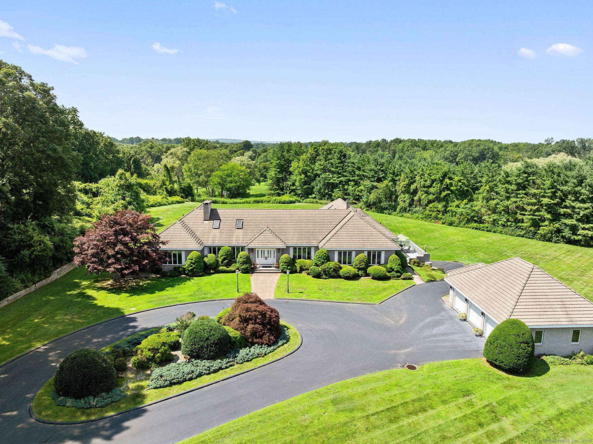 Welcome to a truly one of a kind estate in Suffield, designed and built by a renowned local builder as his personal residence.
