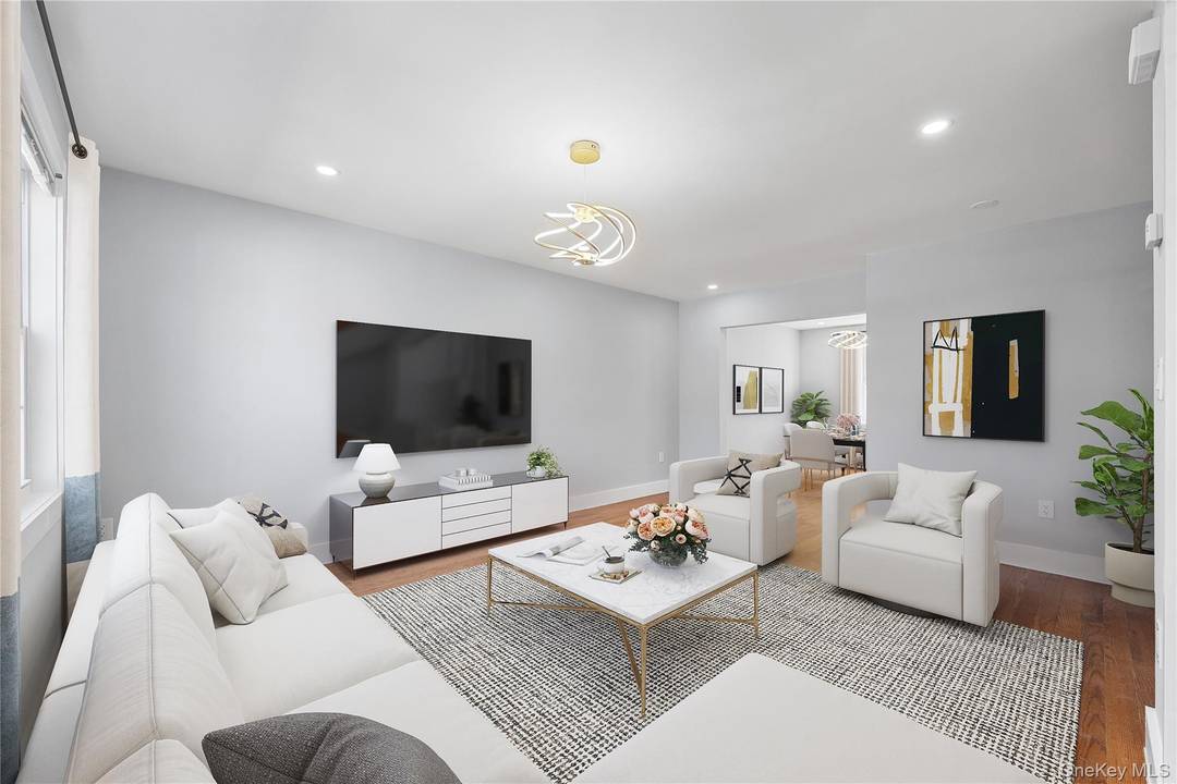 Welcome to 114 66 225th Street, a beautifully maintained home offering 4 spacious bedrooms and 2.