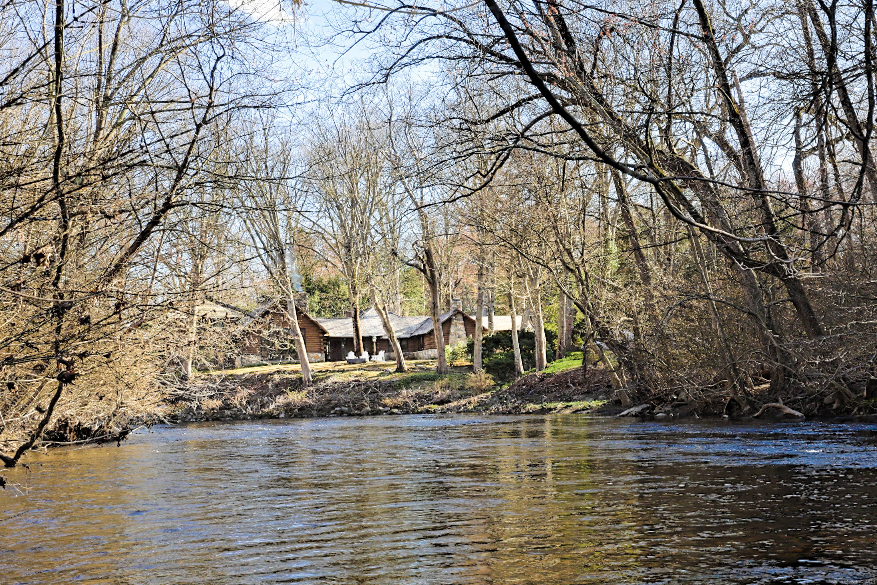 MOST UNIQUE HOUSE IN WESTPORT LARGE LOG HOME ON THE RIVER THAT IS STOCKED WITH TROUT.