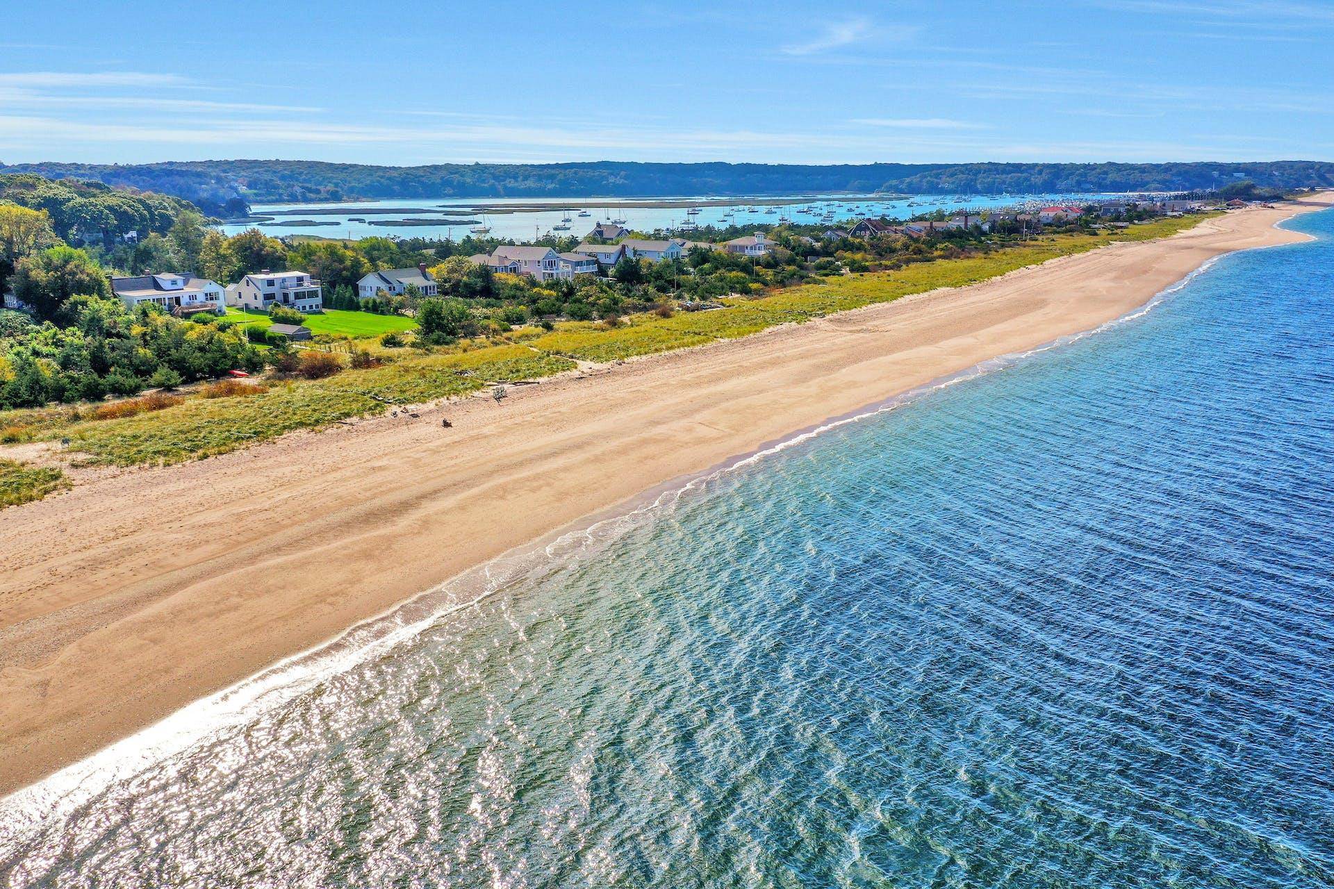 Pristine, waterfront, mid century modern oasis, with 100 feet of private, sandy, beach on the Long Island Sound.