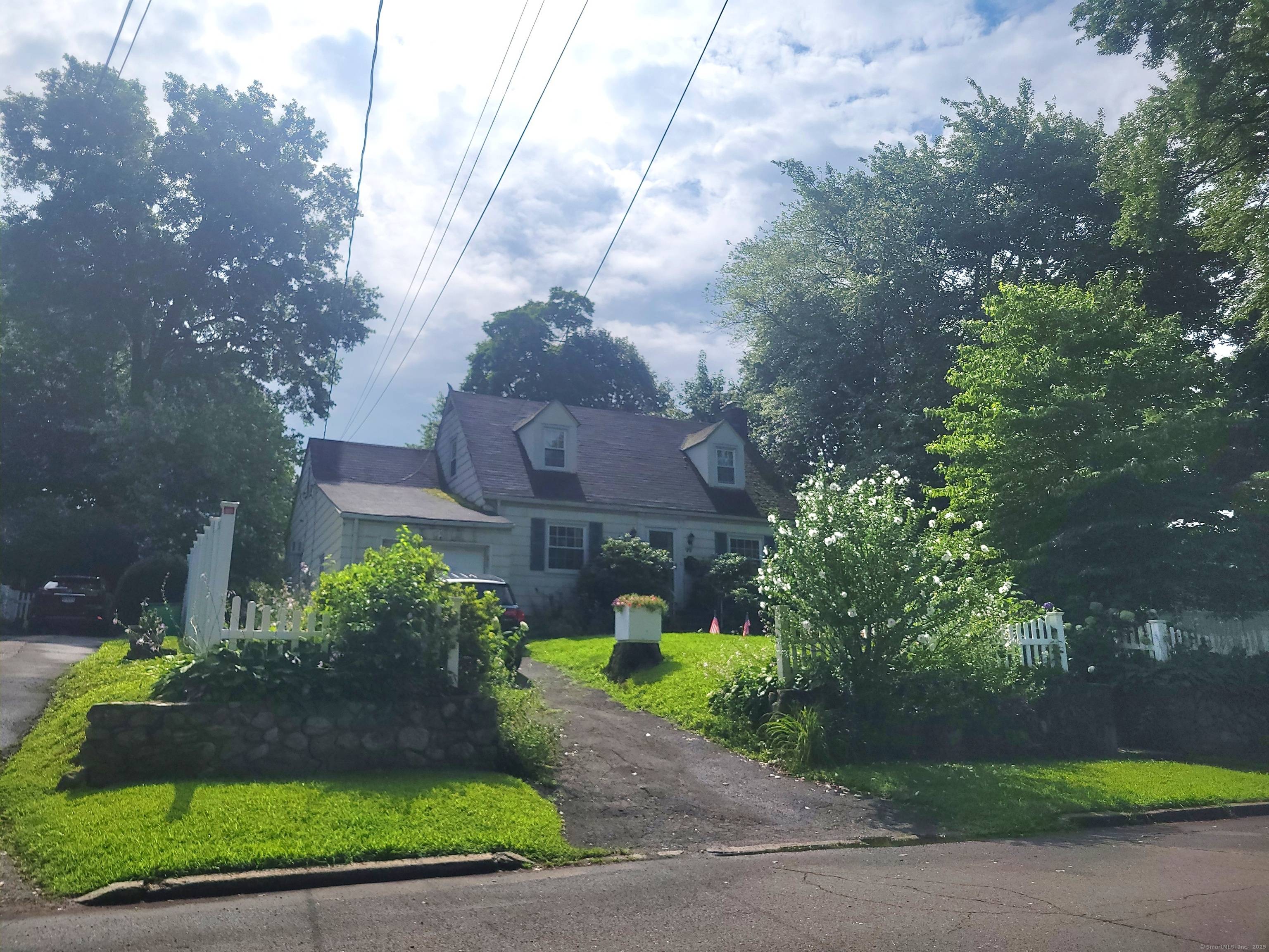 Opportunity awaits in this expanded Cape style home located in the heart of sought after Springdale !