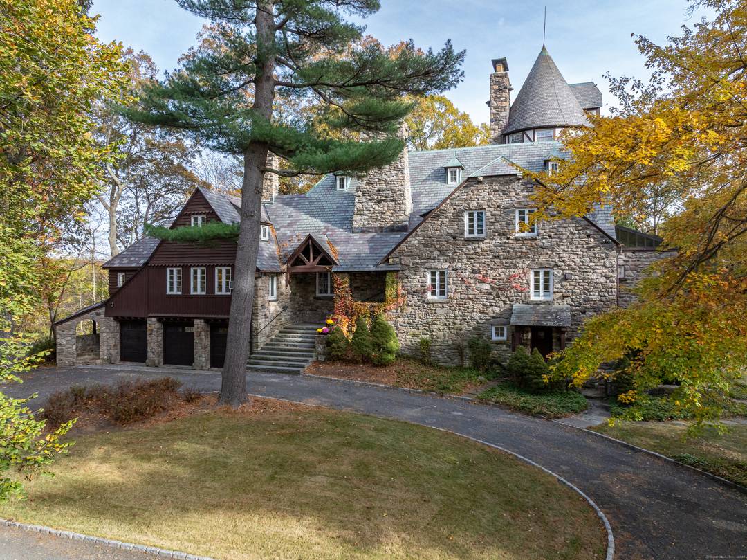 Chateau Rochamore a French Normandy stone manor of timeless grace sits on over three park like acres in North Stamford.