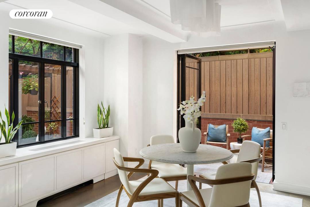 Welcome to 130 West 12th Street, Apartment 1A, a private garden level retreat within one of the Village's most architecturally preserved stretches.