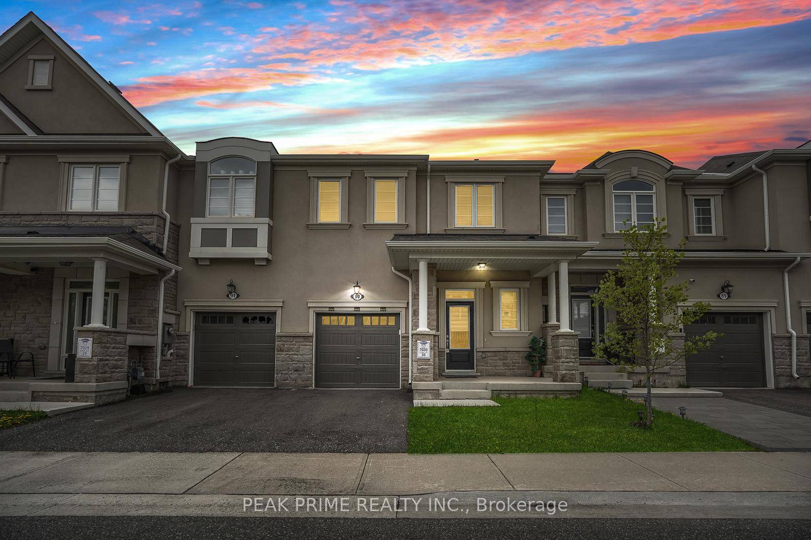 Spacious townhouse featuring a generous basement and a backyard.