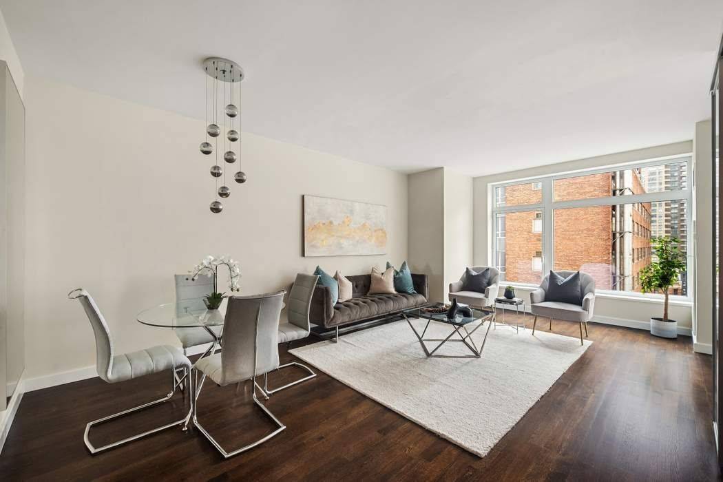 Enjoy the beauty and tranquility of this light filled corner oasis at the luxurious Laurel Condominium !