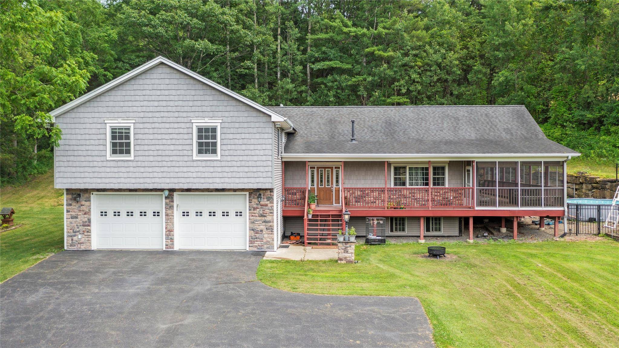 Pristine Tri Level Retreat with Dream Garage, Gym amp ; Stunning Views !