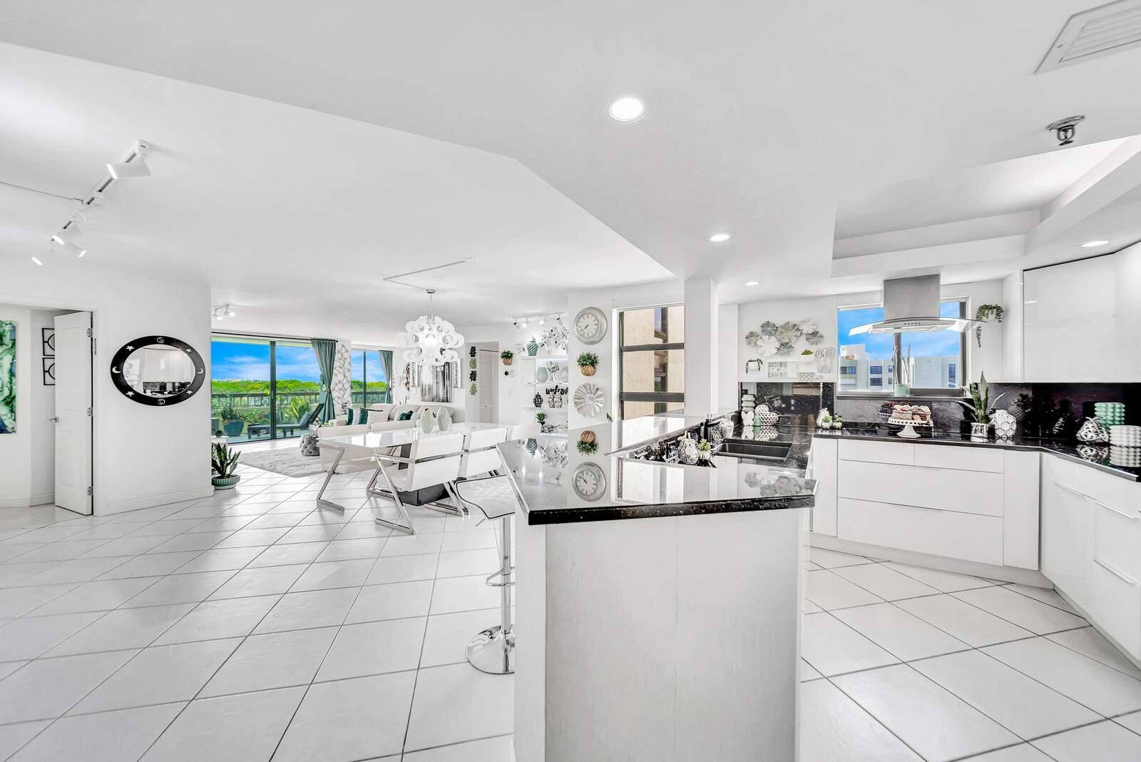 Prepare to be captivated by unmatched panoramic lake views from this stunning 6th floor corner condo, where you'll feel like you're living among the trees and birds.