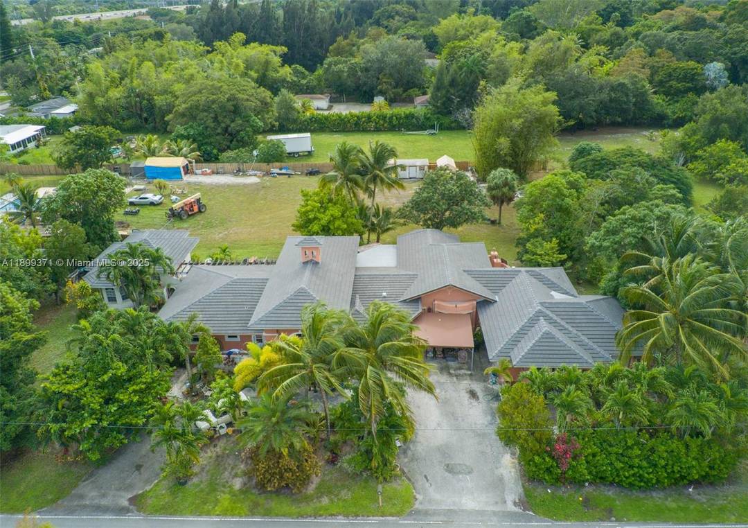 Welcome to 5400 Palm Tree Rd in Plantation a rare ranch style home on over 1 acre.