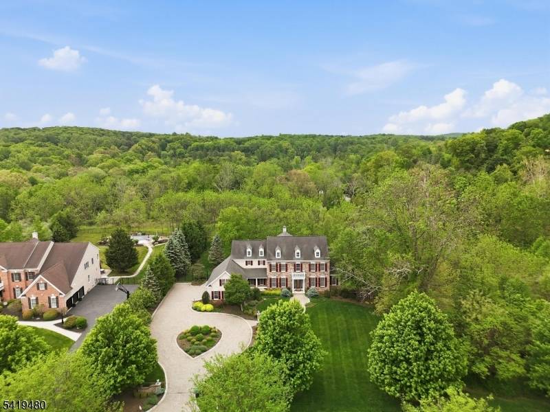 Elegant center hall colonial with Hardy Plank and stone exterior affords a luxurious lifestyle, while offering all the comforts of home.