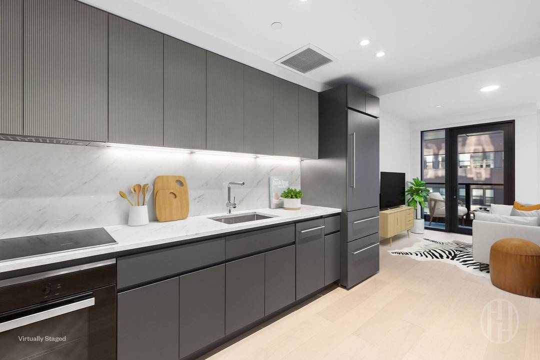 This alcove studio is the epitome of luxury, with top of the line finishes throughout, an in unit washer dryer and a private balcony.