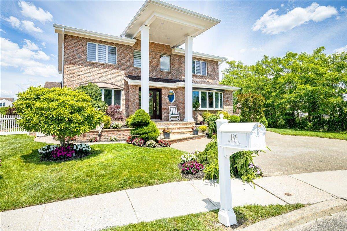 WATERFRONT ENTERTAINERS DELIGHT This Spectacular 4 Bedroom 3 Full Bath Beautifully Updated Colonial sits on a Tranquil Cul De Sac.