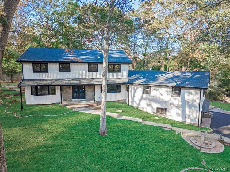 A Serene Retreat in Strathmore at Dix Hills Step into a world of serenity, privacy, and timeless elegance with this stunning modernized colonial perched atop a wooded hill at the ...