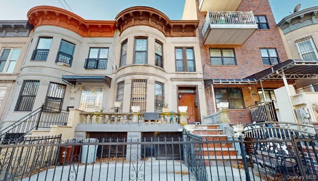 Well maintained two family brownstone configured as a 2 bedroom, 1 bath over a 2 bedroom, 1 bath, plus a finished basement duplexed with the first floor.