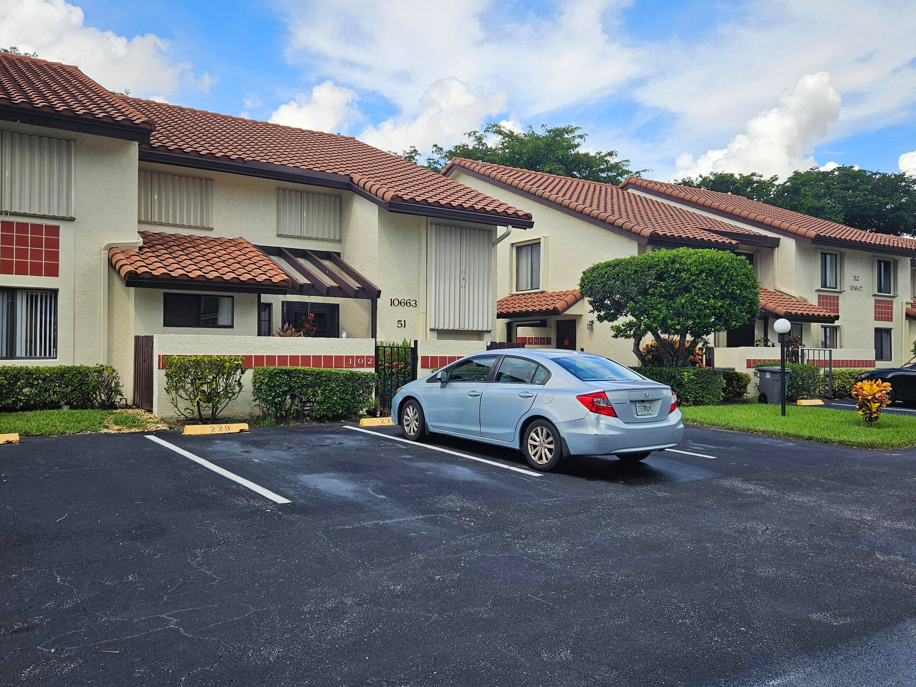 Beautifully updated first floor condo with lake views in the gated community of Palm Chase !