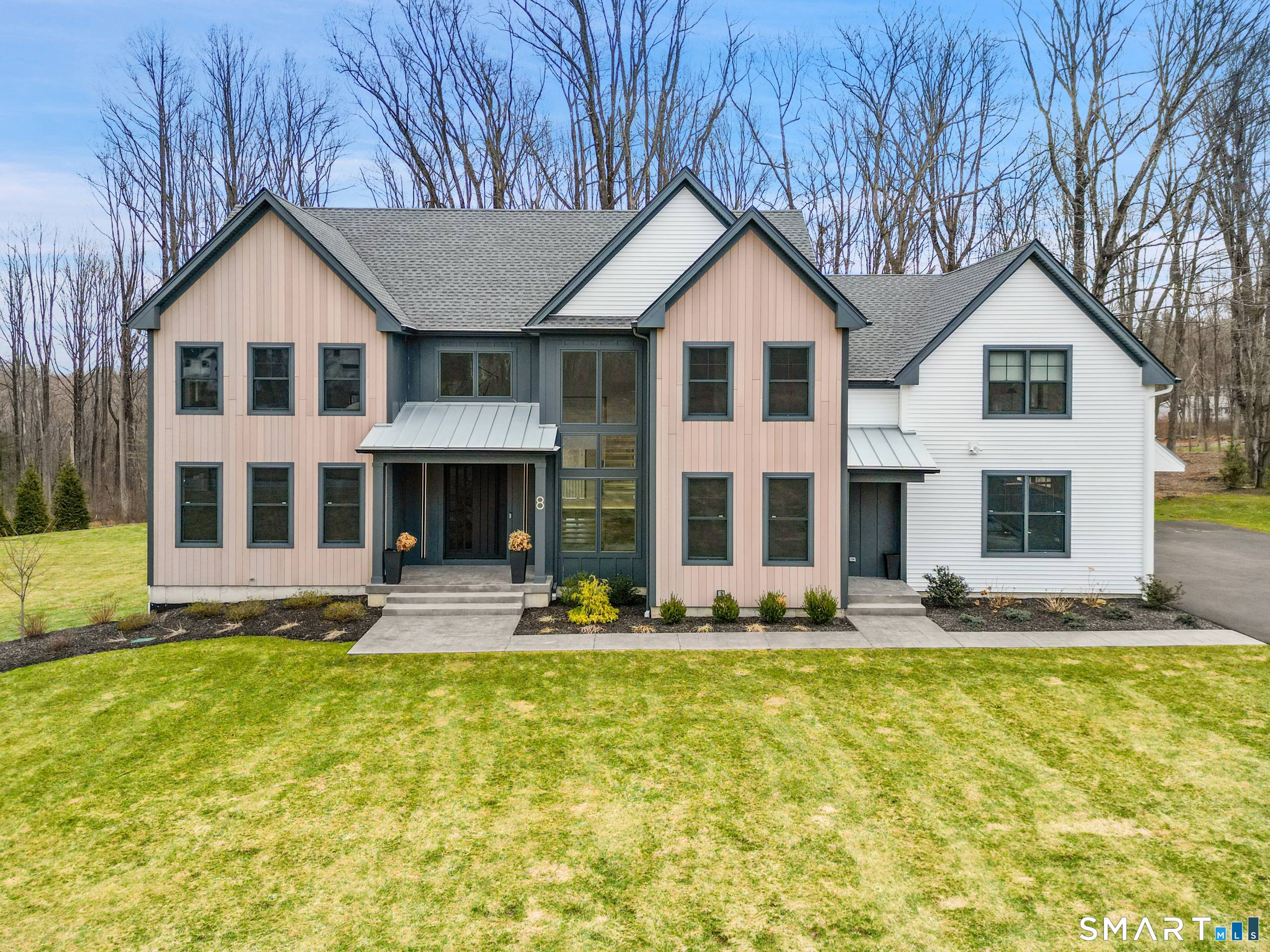 Privately set within an enclave of newer luxury homes on a serene cul de sac, this exceptional residence offers a refined blend of architectural elegance and modern comfort.