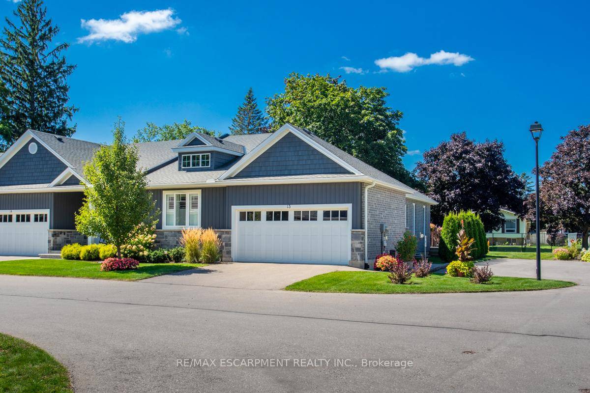 Look no further ! ! Gorgeous Bungalow End unit Town in small enclave of upscale towns.